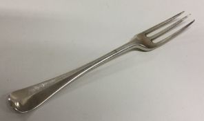 An early Georgian silver three prong fork with cre