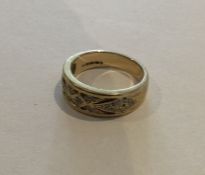 A diamond two colour gold mounted band ring. Appro