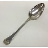 A Swedish silver basting spoon with shell terminal