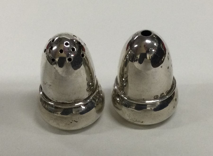 A pair of miniature silver peppers. Birmingham 192