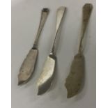 A heavy group of three silver butter knives of sty