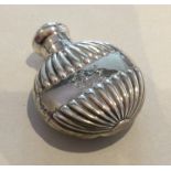 A small Edwardian silver half fluted scent bottle.