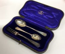 A heavy silver three piece silver christening set.