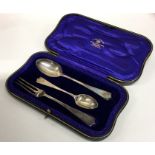 A heavy silver three piece silver christening set.