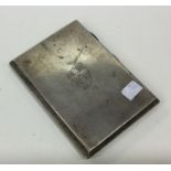 A heavy rectangular silver crested cigarette case.