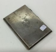 A heavy rectangular silver crested cigarette case.
