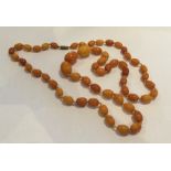 A good string of yellow amber beads. Approx. 53 gr
