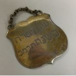 An unusual silver gilt Judaica label. London. Appr