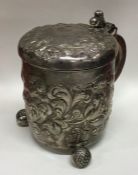 A heavy Norwegian silver lidded tankard chased wit