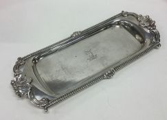 A heavy Georgian silver snuffer tray with gadroon