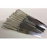 A heavy set of ten silver handled table knives of