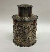 An Edwardian silver tea cannister decorated with f