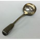 A fiddle pattern silver sauce ladle. London. By EB