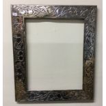 A large rectangular silver picture frame of stylis