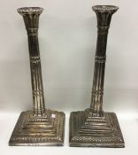 A pair of large Georgian silver candlesticks of fl