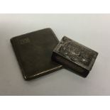 A heavy engine turned silver cigarette case togeth