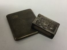 A heavy engine turned silver cigarette case togeth