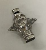 A novelty chased silver whistle with embossed deco