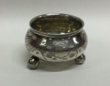 A Russian silver salt with engraved decoration to