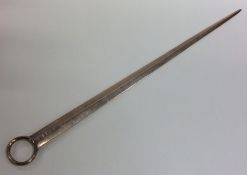 A large Georgian silver meat skewer with ring term