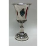A silver Kiddush cup attractively decorated with t