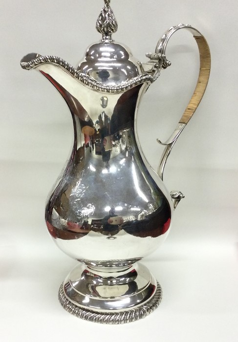 A massive Georgian silver beer jug of substantial