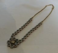 A heavy high carat gold and enamelled necklace wit