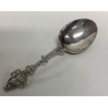 A Dutch silver spoon decorated with figures and sc