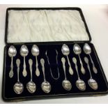 A good cased set of twelve bright cut silver teasp