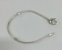 A modern silver mesh bracelet with heart shaped pa