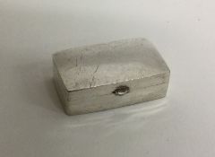 A rectangular hinged top silver pill box. Approx.