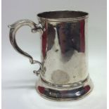 An early Georgian silver tapering mug on spreading