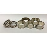 A collection of silver napkin rings. Various dates