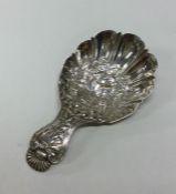 A heavy chased silver caddy spoon. Birmingham. By