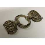 A Chinese silver gilt belt buckle cast with flower