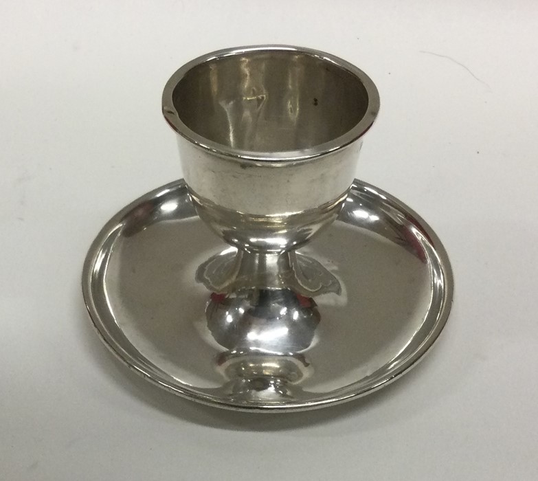 An Edwardian silver egg cup on stand. Birmingham.