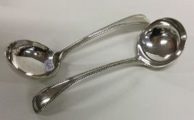 A good pair of silver sauce ladles with beaded rim