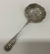 A decorative Continental silver ladle cast with fi