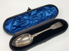 A cased silver fiddle pattern dessert spoon. Londo