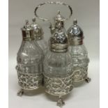 A George II solid silver five bottle cruet with pi