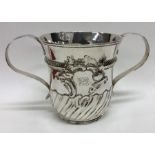 A George II silver two handled porringer with swir