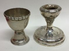 A small silver dwarf candlestick together with an