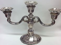 A Continental cast silver candelabra with flowing