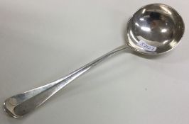 A heavy OE and rat tail pattern silver sauce ladle