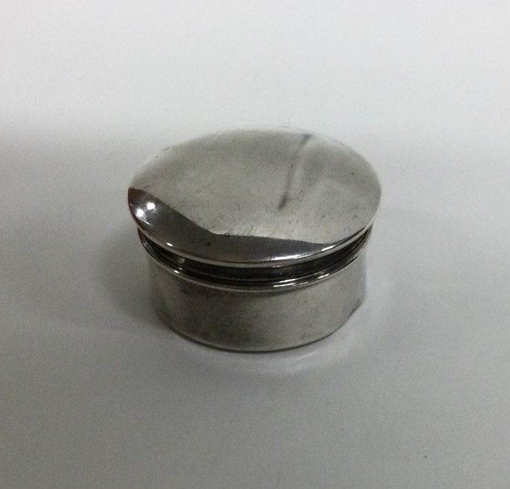 A small silver pill box with gilt interior. Birmin