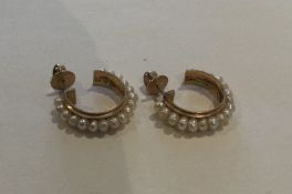 A pair of Continental pearl and gold hoop earrings