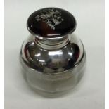 A silver tortoiseshell mounted scent bottle with h
