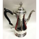 A George III baluster shaped silver coffee pot wit