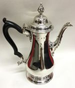 A George III baluster shaped silver coffee pot wit