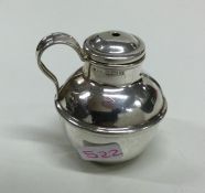 A novelty silver pepper in the form of a jersey ca